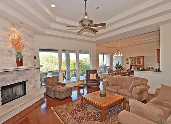 Family Room with Wood Floors & Corner Fireplace
