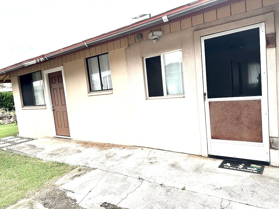 Front door leads to living room, screen door leads to the enclosed car port where the washing machine & dryer are located.