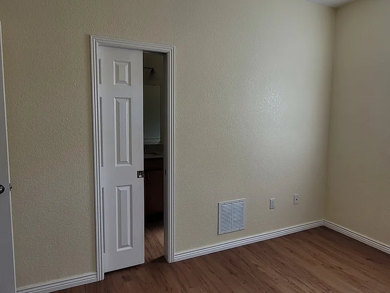 Master bedroom has a "pocket door" directly into the bathroom. The door slides out of the "pocket" in the wall to close and back into the "pocket" in the wall to open.