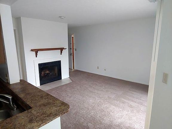 Living room and entry looking from dining area