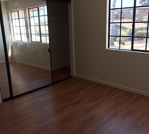 Other bedroom with mirror closet door