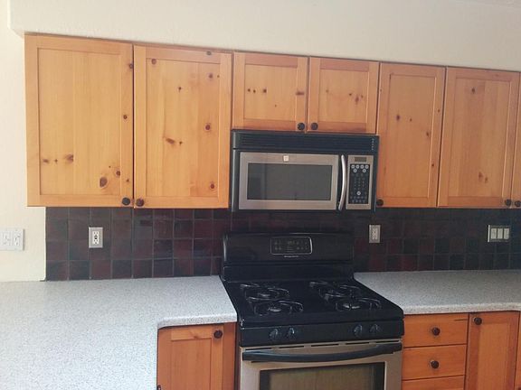 kitchen w/ black & steel appliances