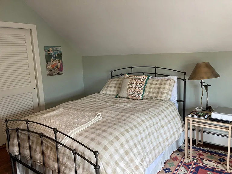 Primary bedroom features a large closet and ceiling fan/light