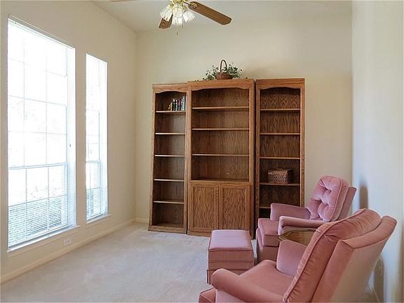 The formal living room or study is just across the entryway from the dining room.