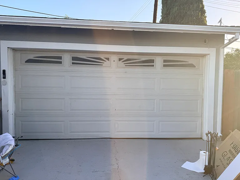 Two-car garage with remote-controlled garage door opener
