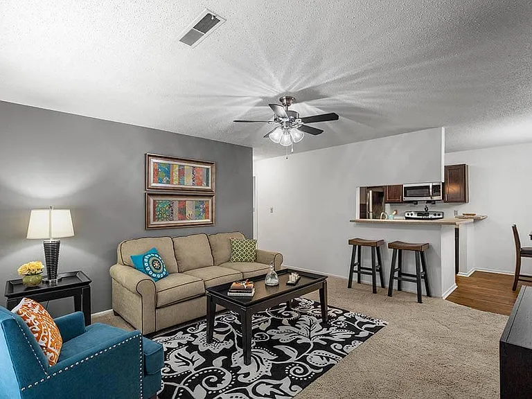 Carpeted Living Room with Ceiling Fan