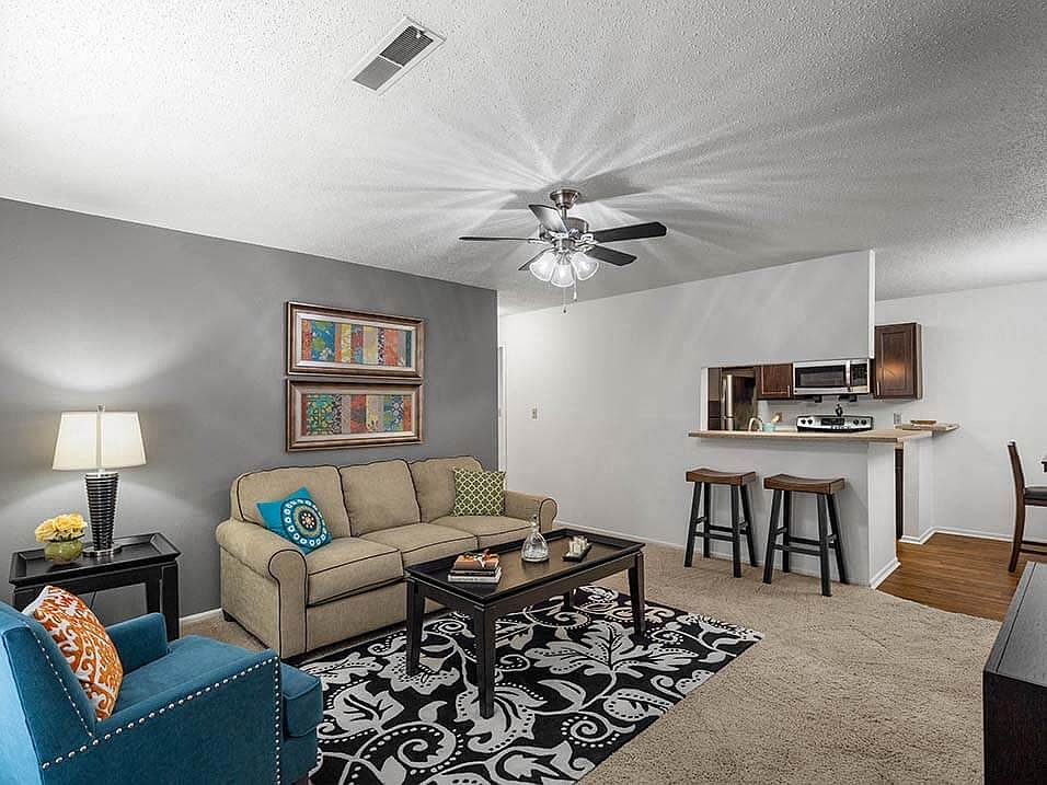 Carpeted Living Room with Ceiling Fan