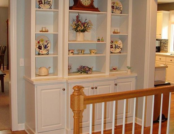This built-in bookcase cabinet stays. This is the view from the from door with the living room to the left.