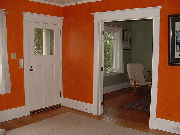 French doors lead to one of four bedrooms (used as den).