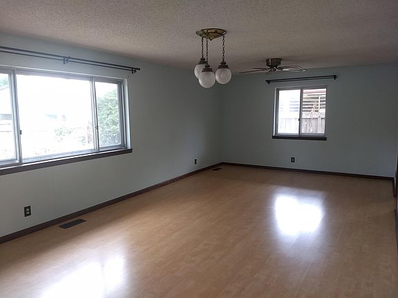 Large, well-lit living room.