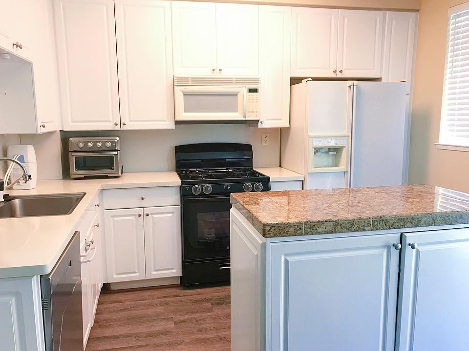 Freshly painted cabinets, new gas range and stainless steel dish washer. New flooring.