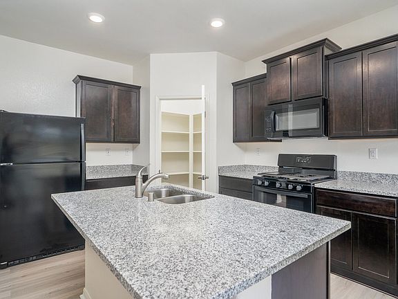 Incredible kitchen with massive island and gorgeous granite counters