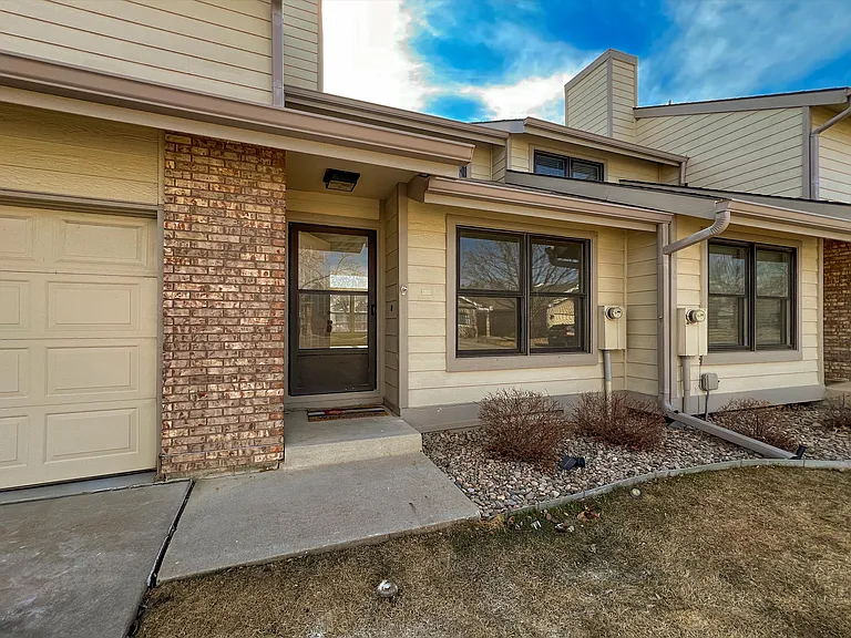 Front entrance. Includes 2 car attached garage, driveway, and plenty of parking spaces in back.