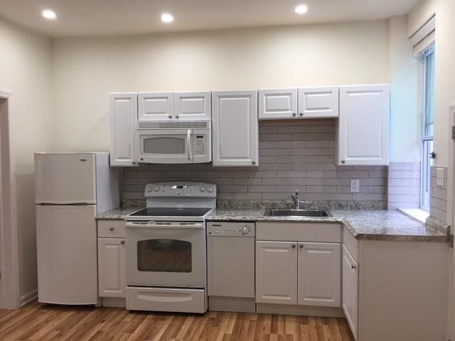 Kitchen with full appliances and garbage disposal