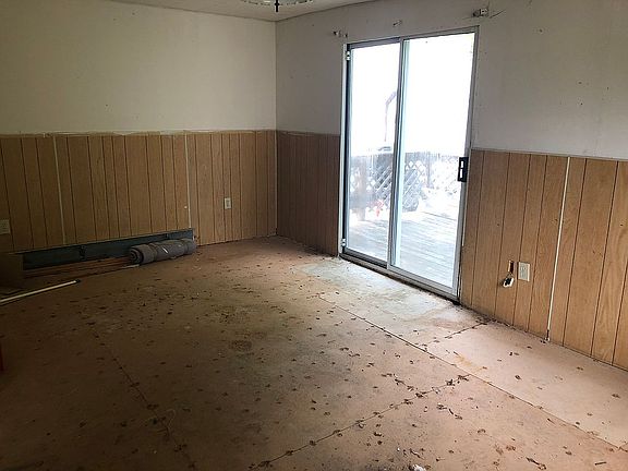 Living room w/ door to deck