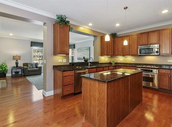 Large eat-in kitchen is open to beautiful family room.