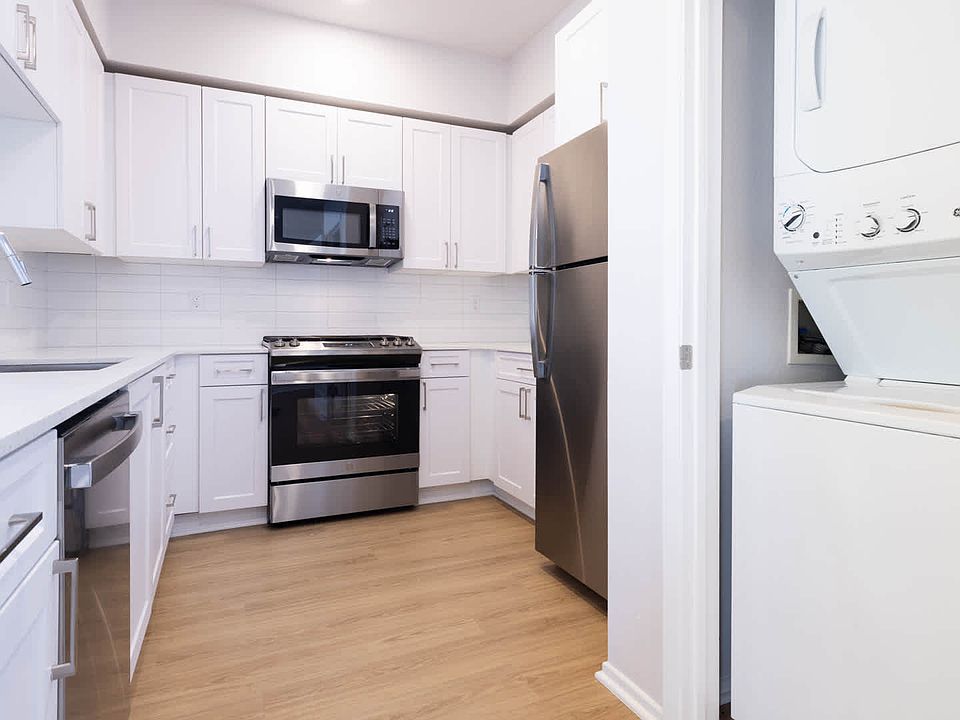 Kitchen with Stainless Steel Appliances and In-home Washer and Dryer