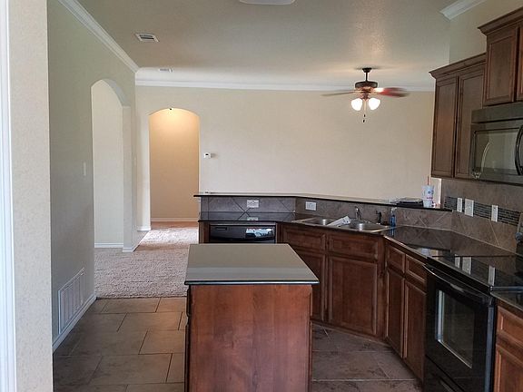Granite Counters, Tile floors, Glass Tile Backsplash, Black 