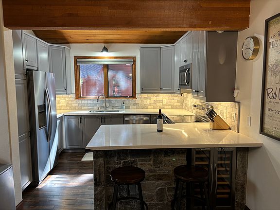 2nd floor. Open floor plan kitchen, with bar seating, upgraded cabinets, counter tops, under cabinet lighting and appliances.