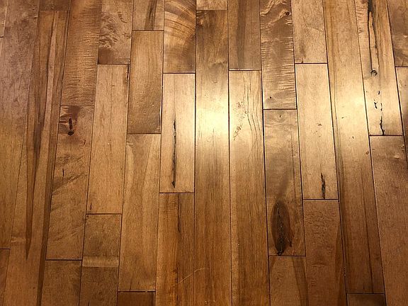 Detail of the wood floors throughout the home (Kitchen has tiles).