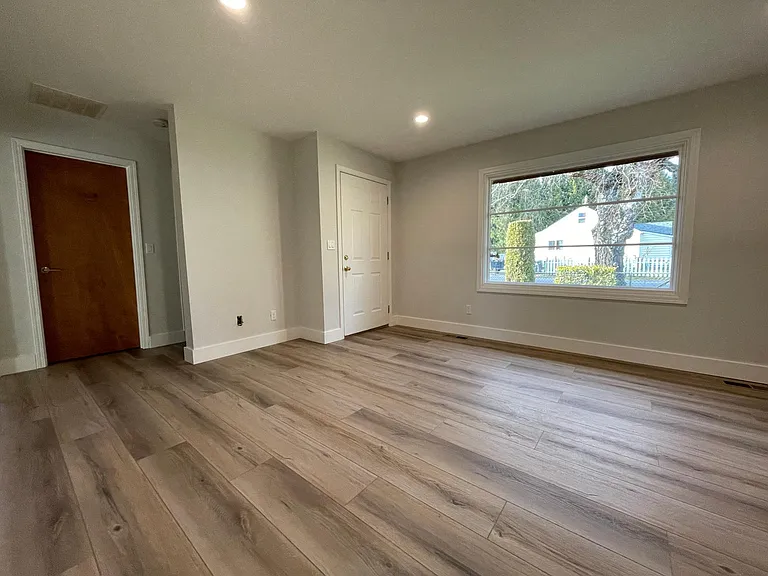 Unit 413 has refinished hardwood flooring rather than LVT like this unit 417