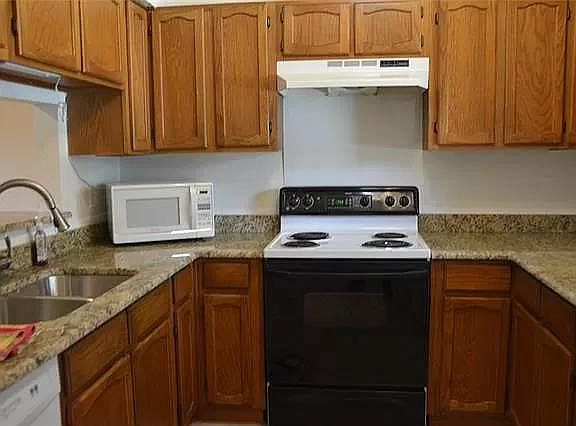 Kitchen with new granite counter tops and undermount sink