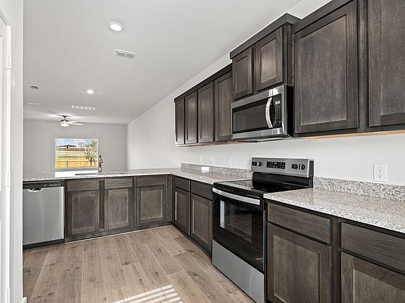 The kitchen has stainless-steel, energy-efficient appliances.