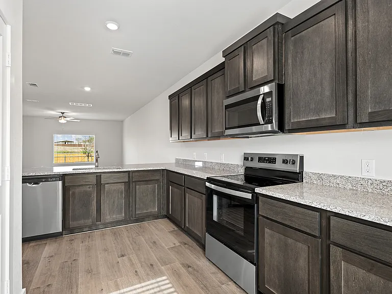 The kitchen has stainless-steel, energy-efficient appliances.