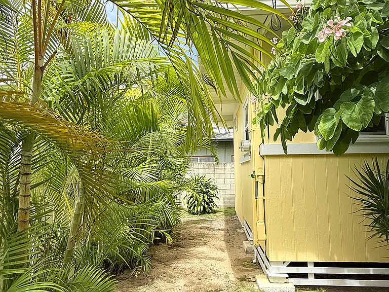 Left side of cottage, leads to the back