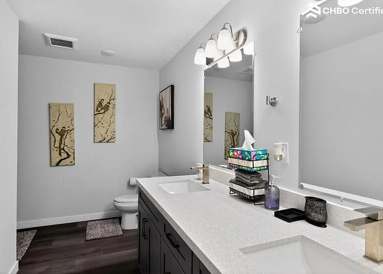 Updated bathroom with double vanity and modern fixtures