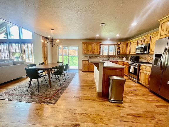 Living room, dining room, and kitchen all in one space