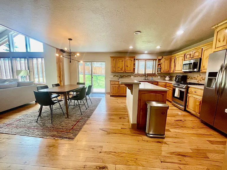 Living room, dining room, and kitchen all in one space