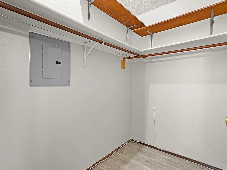 master's bedroom with walk in closet