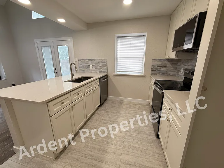 Open Kitchen - new appliances, soft-close cabinets, garbage disposal.