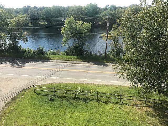 View of pond and street from living room window.