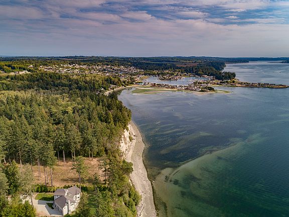 Rare estate sized (2.8 acres) private waterfront compound on the northern shores of magical Hood Canal!
