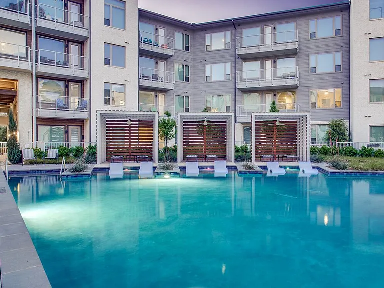 Pool and sundeck with private cabanas