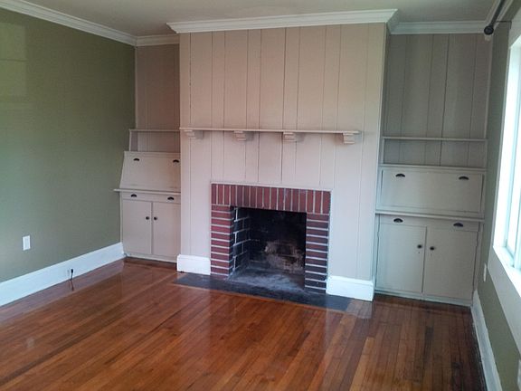 Living room with functioning fireplace