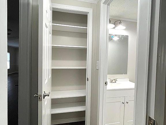 Linen closet with shelves.