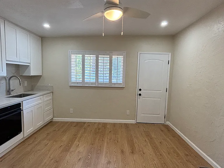 Solid wood high quality shudders on dual-paned windows. New ceiling fan and new can lights in ceiling and new under cabinet lighting.