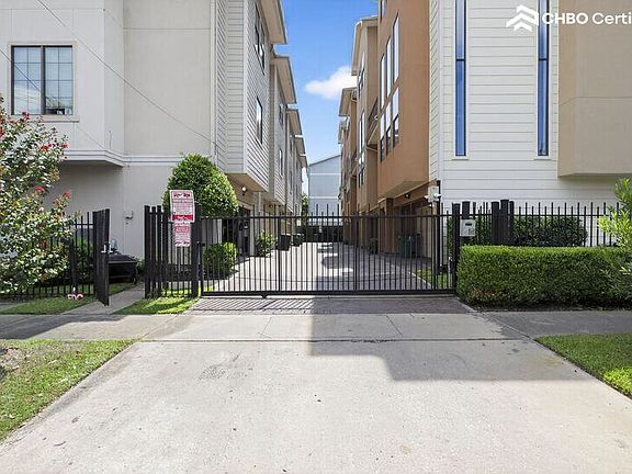 Gated entry with man-gate near the mailboxes