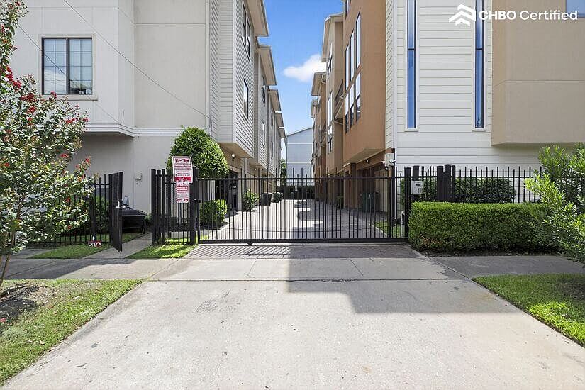 Gated entry with man-gate near the mailboxes