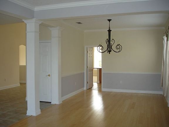 Formal Dining with Bamboo Wood Floors and Lake View