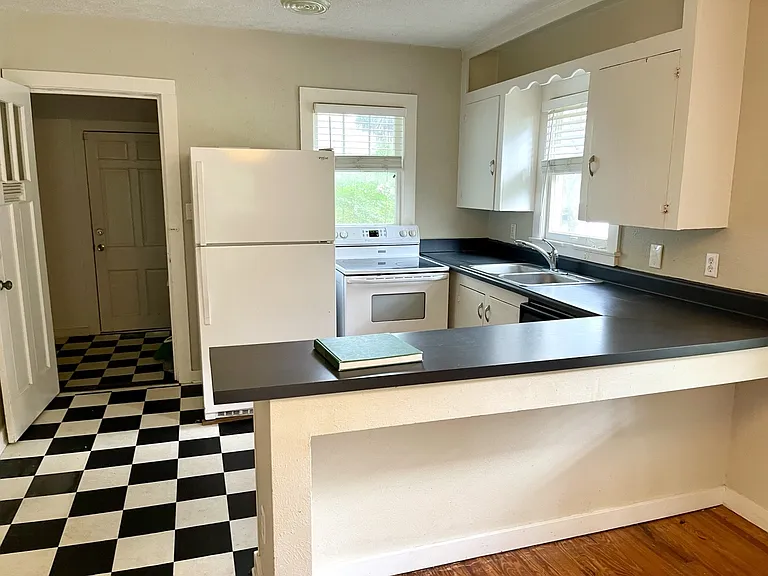 Kitchen with a convenient side entry/mudroom that provides additional storage.