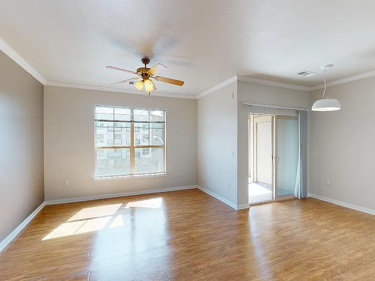 Apartment living room with wood-style flooring.