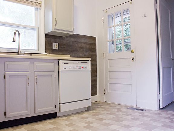 The kitchen opens up to a private patio area in the back yar