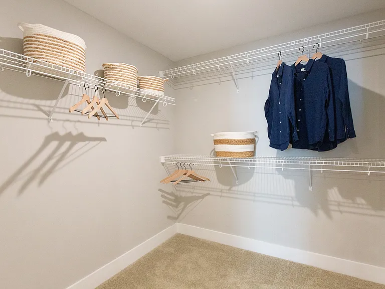 Bedrooms include large walk-in closets with shelving.