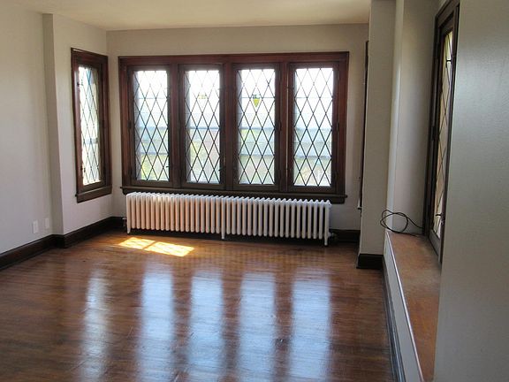 Living room, viewed from dining room, showing architectural windows