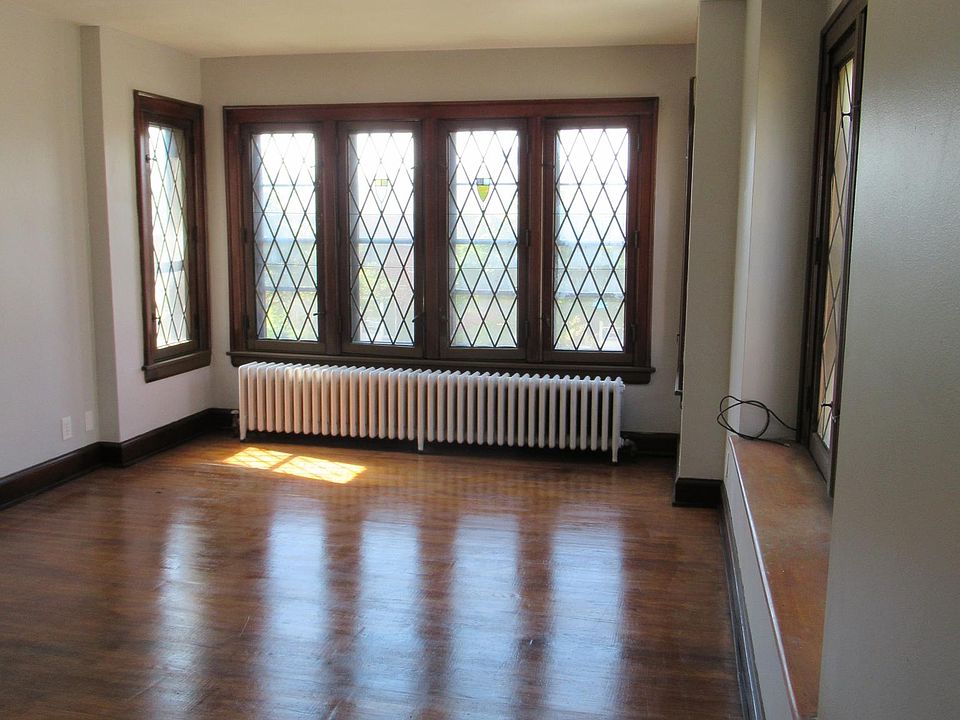 Living room, viewed from dining room, showing architectural windows