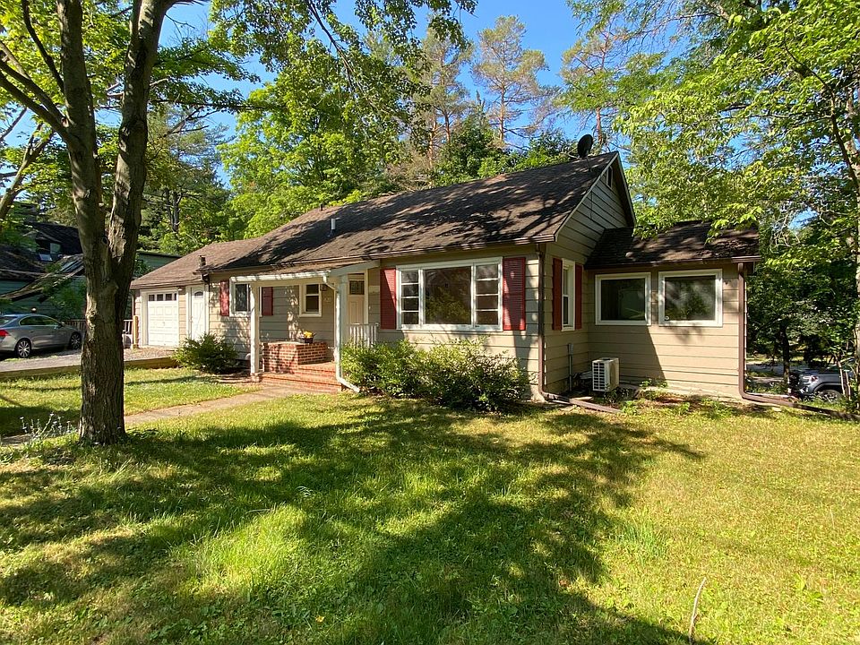 Parking for 2-3 cars depending on the size of the vehicle. If your guests can park you in, 3-4 cars could fit off-street. The sunroom is to the right in this picture. It would make a wonderful craft room, yoga studio or reading nook.